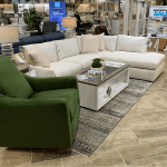 green accent chair with cream L couch